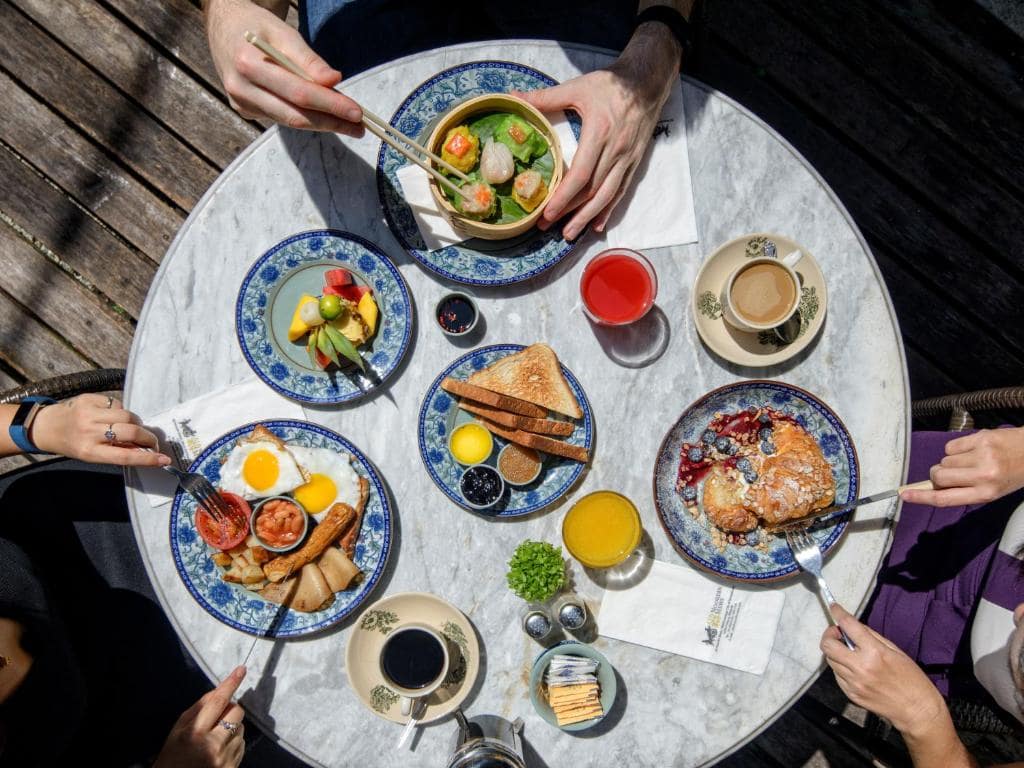 overhead-shot-of-people-enjoying-meals-in-the-hotel